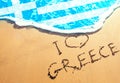 Beach sand, sea and flag Greece. I love Greece concept