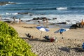 Beach scene on a busy spring day with people at leisure at Farol da Barra beach in Salvador, Brazil