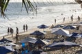 Beach scene on a busy spring day with people at leisure