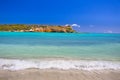 Beach scene with clear blue water, blue sky and sandy shore seen from Puerto Rico