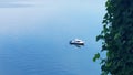 Beach Scene with fishing boat, tree lea Royalty Free Stock Photo