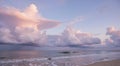 A beach scene with dramatic clouds over the ocean during sunseta Royalty Free Stock Photo