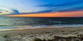 Beach scene in Nags Head NC sunset on a clear blue day Royalty Free Stock Photo