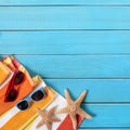 Summer background beach scene blue wood sunglasses starfish Royalty Free Stock Photo