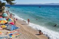 Beach scene with people in Podgora, Croatia