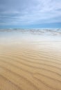 Beach scene with sand ripples and beautiful sky Royalty Free Stock Photo