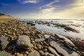 Beach scene showing water and sky and the sun shining Royalty Free Stock Photo