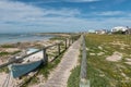 Beach scene in Struisbaai with the boardwalk and dinghy visible