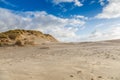 Beach scenery along Dutch North Sea coast with beach blown by Royalty Free Stock Photo