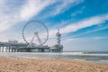 Beach of Schevening Netherlands during Spring, The Ferris Wheel The Pier at Scheveningen in Netherlands, Sunny spring Royalty Free Stock Photo