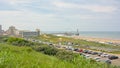 Beach of Scheveningen, with apartment buildings, pier and parking lot Royalty Free Stock Photo
