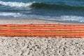 Beach screen on the Polish beach on a sunny summer day in the background a rough sea. Royalty Free Stock Photo