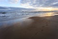 Beach and sea against a cloudly sky in winter