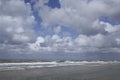 Beach, sea, clouds and a blue sky, The Netherlands Royalty Free Stock Photo