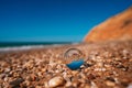 Beach with sea photographed through a crystal ball. The picture in the ball is in focus and the background is out of focus. Royalty Free Stock Photo