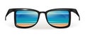 The beach of the sea is reflected in sunglasses Royalty Free Stock Photo