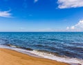 The beach and sea surface with Deep Blue sea clear sky clouds. Landscape with Ocean small waves water reflection copy space for Royalty Free Stock Photo