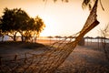 Beach and sea view with empty hammock at sunset Royalty Free Stock Photo