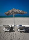 Beach and sea view with sunshade and two beds and blue sky Royalty Free Stock Photo