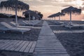 Moody beach and sea view with sunshades at sunset chillout color split toning Royalty Free Stock Photo