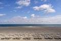 Beach at the seaside with empty sunbeds