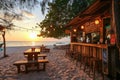 A beach shack bar at sunset, with a few tables on the sand, Ai generated Royalty Free Stock Photo