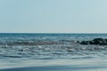 Beach on the shore of the ocean, the sea is a clear sunny summer Royalty Free Stock Photo