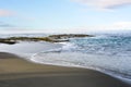 Beach shoreline with gentle surf