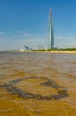 A beach on the shores of the Gulf of Finland overlooking the Lakhta Center, a skyscraper in St. Petersburg that will house the