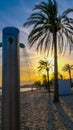 Beach shower on sandy beach on the background of sunset and palm trees Royalty Free Stock Photo