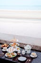 Afternoon tea set with tart and pastry bakery desserts by the beach Royalty Free Stock Photo