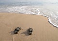 Beach slippers in the sand on beach