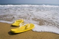 Beach slippers on a sandy beach