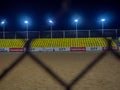 Beach soccer field through the fence mesh. Sand play concept. Competition sponsors. View of the viewer. Team Confrontation