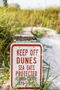 Beach stay off sand dunes sign