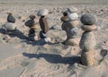 Beach stone figures marching off into the distance