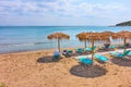 Beach with straw umbrellas by the sea