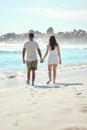 Beach strolls with you are the best. a young couple enjoying a day at the beach. Royalty Free Stock Photo