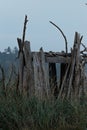 Beach structure made from driftwood with walls and a roof Royalty Free Stock Photo