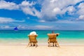 Beach summer couple on island vacation holiday relax in the sun