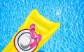Beach summer holiday background. Inflatable air mattress, flip flops and hat on swimming pool. Yellow lilo and summertime Royalty Free Stock Photo