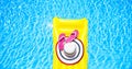 Beach summer holiday background. Inflatable air mattress, flip flops and hat on swimming pool. Yellow lilo and summertime Royalty Free Stock Photo