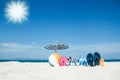 A Beach summer holiday banner background. Flip-flops and hat with a board and ball on the sand near the ocean. Summer accessories Royalty Free Stock Photo