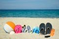 family slippers on the seashore in the sand Royalty Free Stock Photo