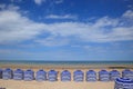 Beach in summer with tents, sun and blue sky Royalty Free Stock Photo