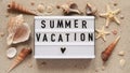 Beach summer vacation banner concept.Text board with the inscription SUMMER VACATION, seashells and starfish lie on the sand, top Royalty Free Stock Photo