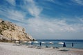 Picturesque pebble Traganou Beach with sun beds and umbrellas on the island of Rhodes, Greece. Royalty Free Stock Photo