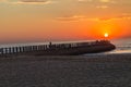 Beach Sunrise Pier Fishermen Royalty Free Stock Photo