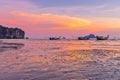 Beach and sunset at Ao Nang, Krabi, Thailand with traditional th