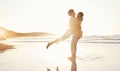 Beach, sunset and happy couple hug, love enjoy quality time together on South Africa vacation, travel or romantic date Royalty Free Stock Photo